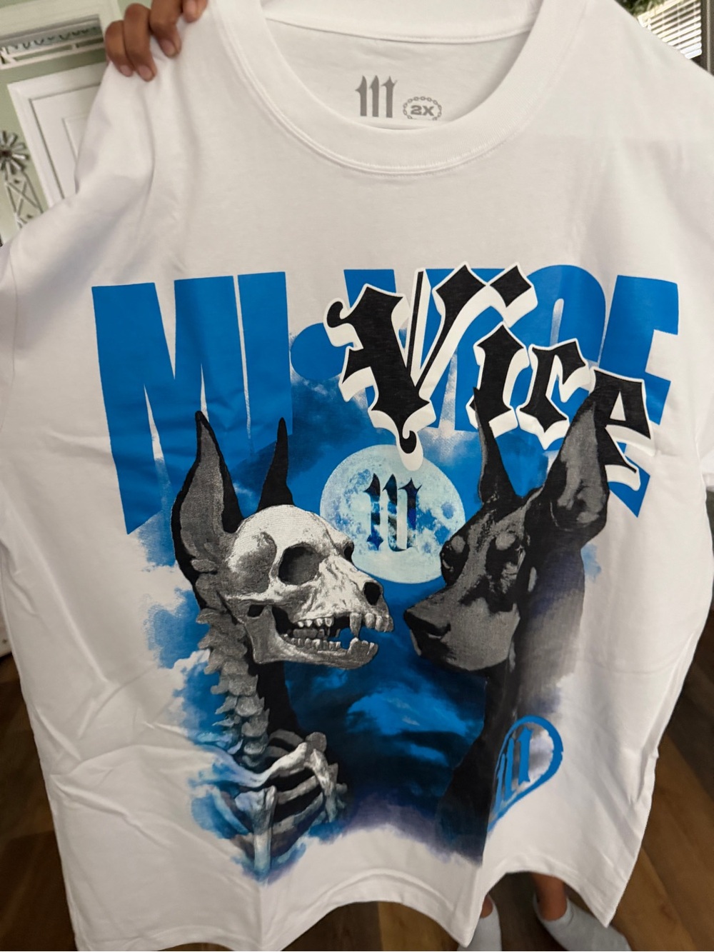 White Short-Sleeve Graphic Tee with Blue Skull & Dog Artwork Brand New